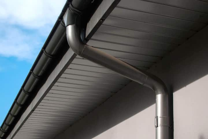 Corrosion-resistant galvanized gutters installed on a commercial building in Tampa